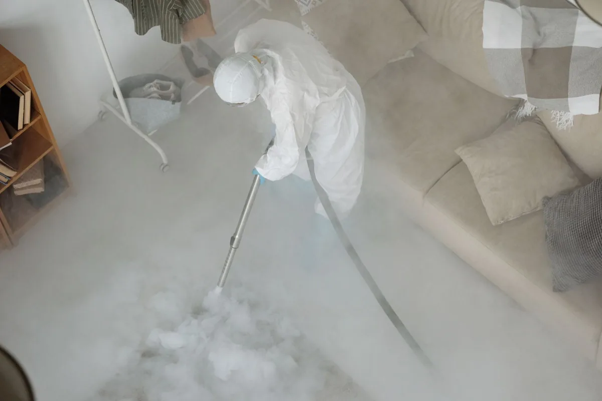 Biohazard cleanup technician in protective equipment, Cohoe, AK